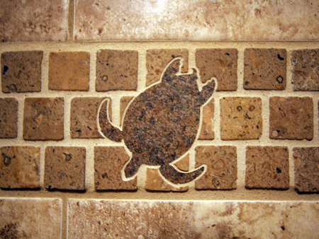 CLOSE UP OF BORDER TILE WITH TURTLE INLAY